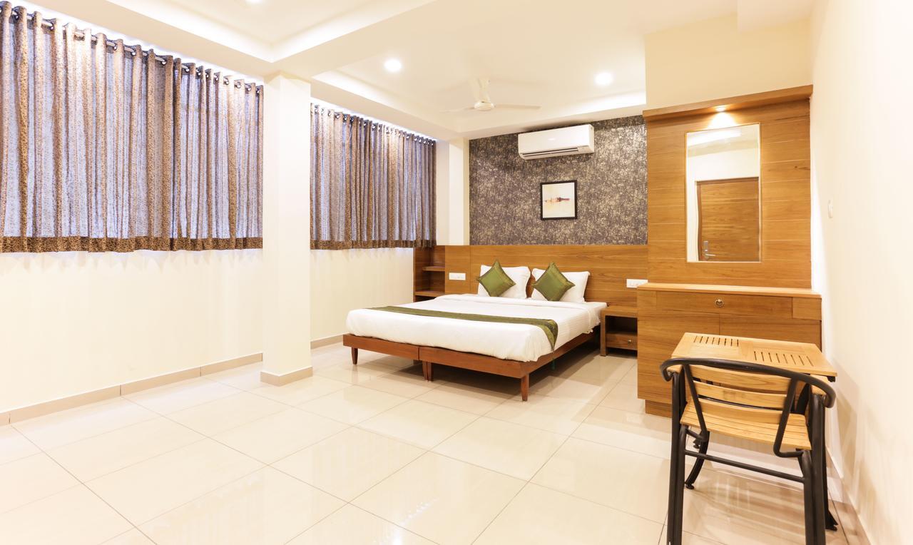 Treebo Trend Cmks Gulmohar Suites Kochi Extérieur photo