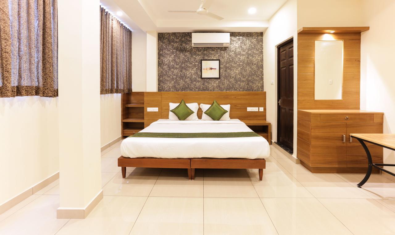 Treebo Trend Cmks Gulmohar Suites Kochi Extérieur photo